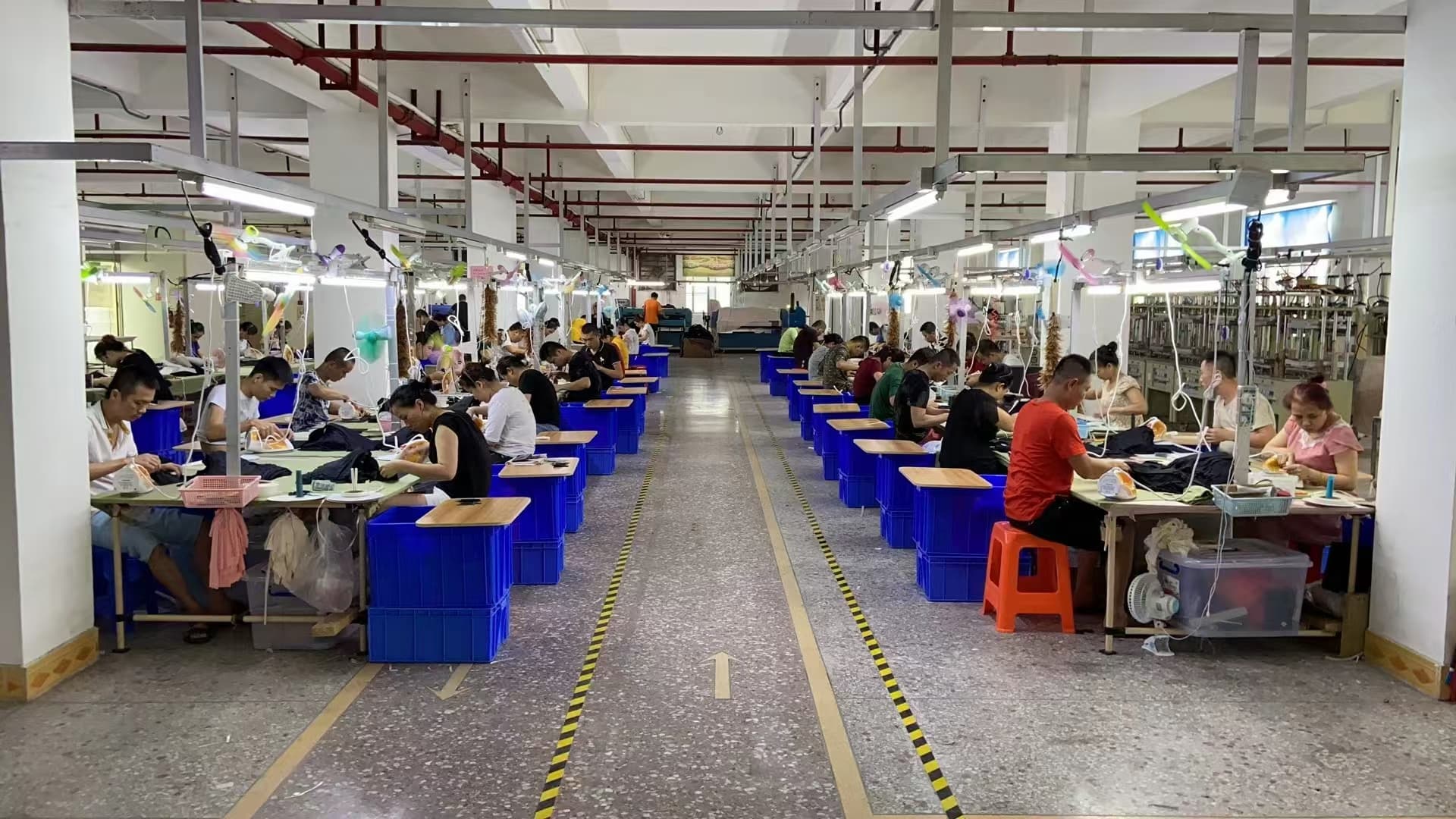 Organized sewing production line inside the Xinnishi factory